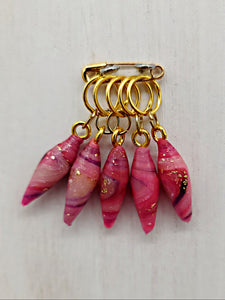 Pink marbled stitch markers - long